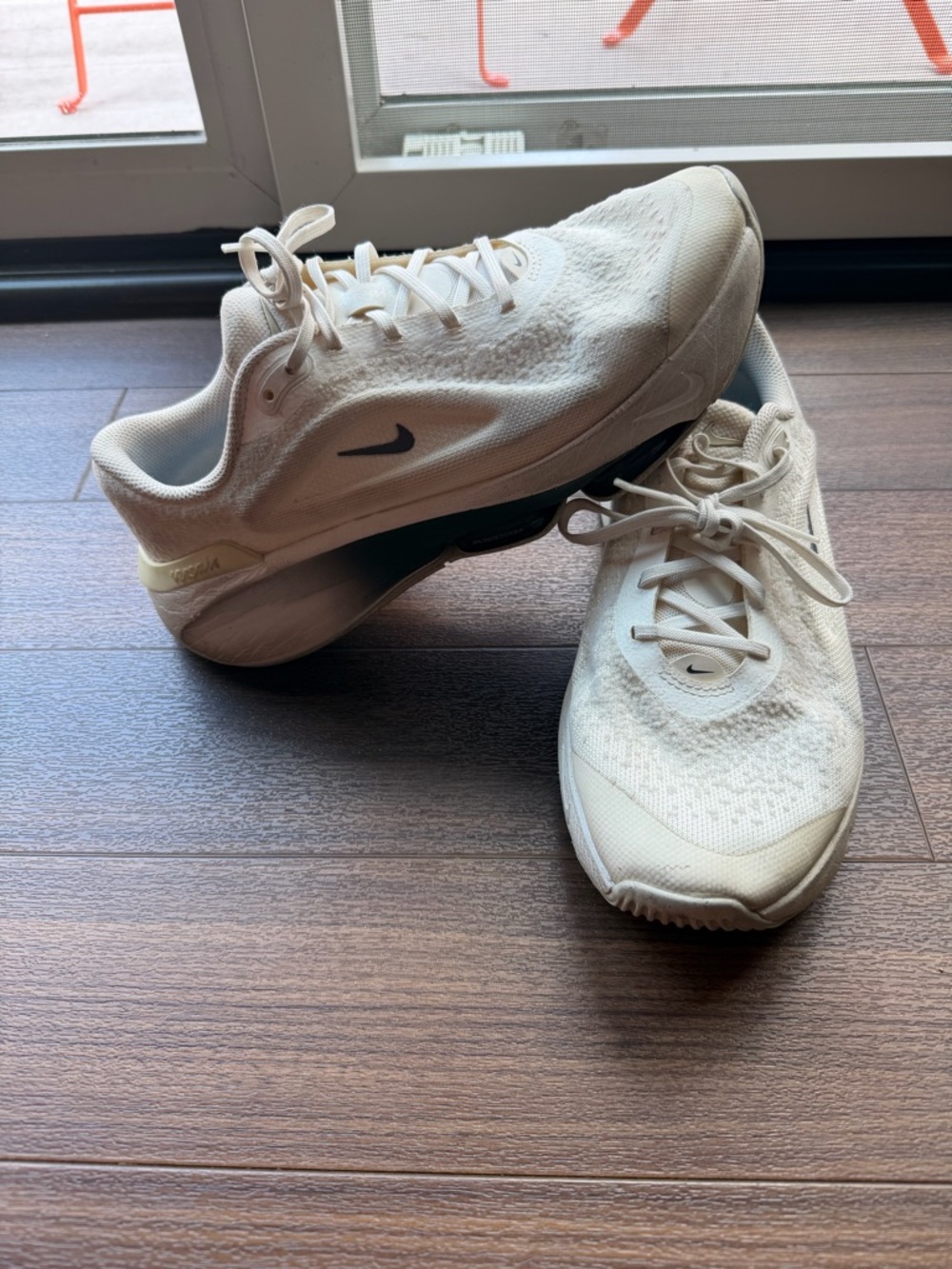 Nike Cream and Black athletic sneakers